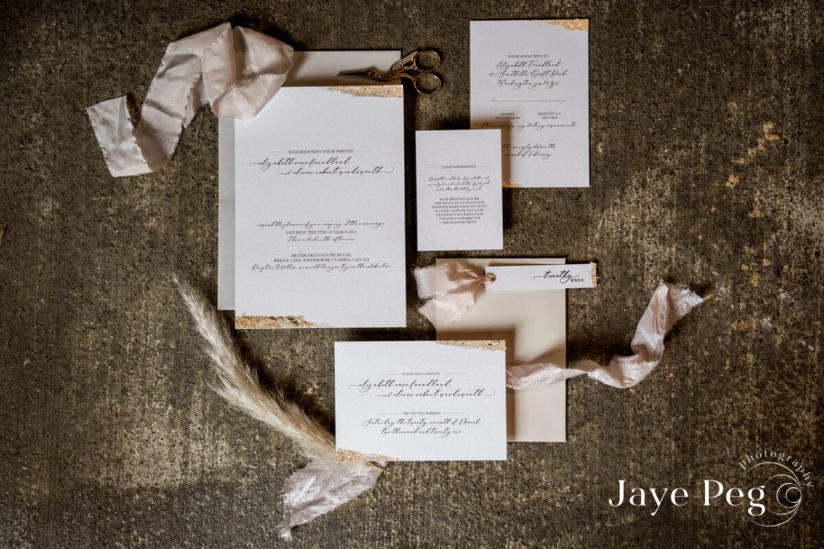 a flat lay of wedding stationery