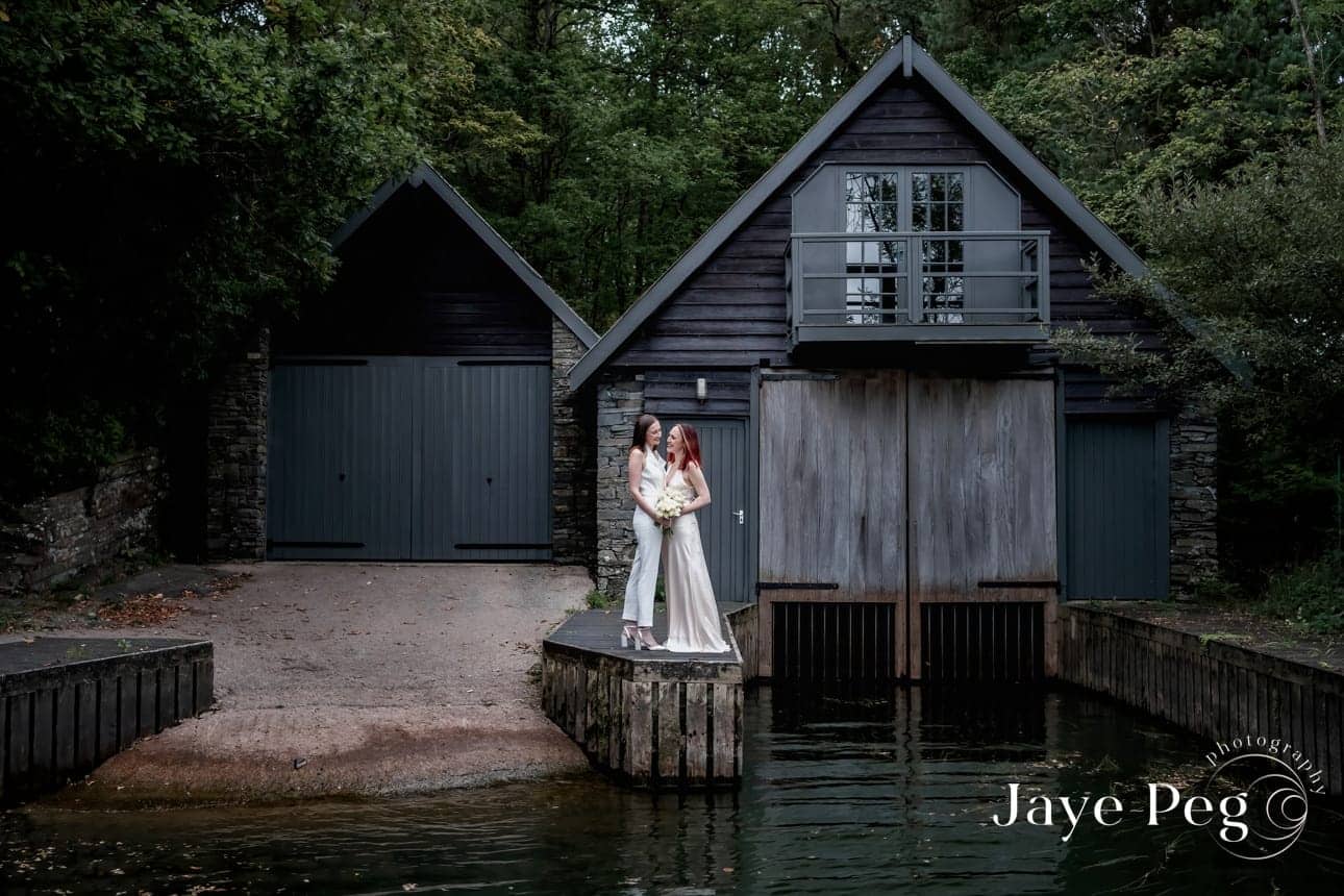 two brides in front of a windermere boat house at cragwood country house hotel