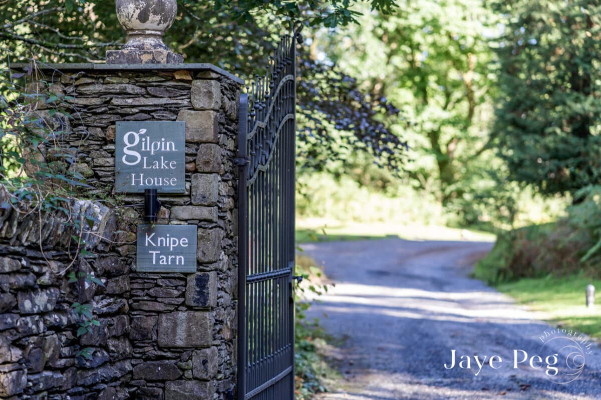 the gated entrance to gilpin lake house in the lake district