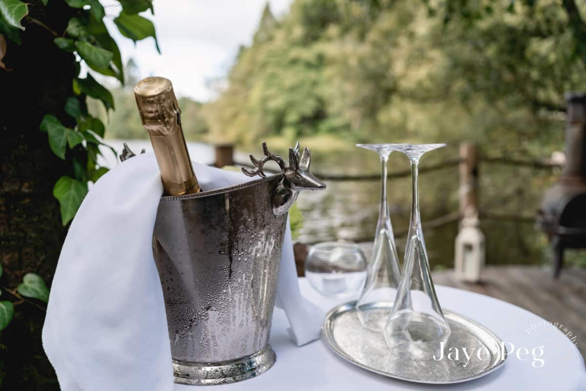 champagne setup ready for a wedding to be toasted at gilpin lake ahouse