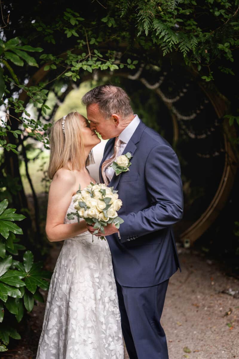 a newly wed couple sharing a kiss